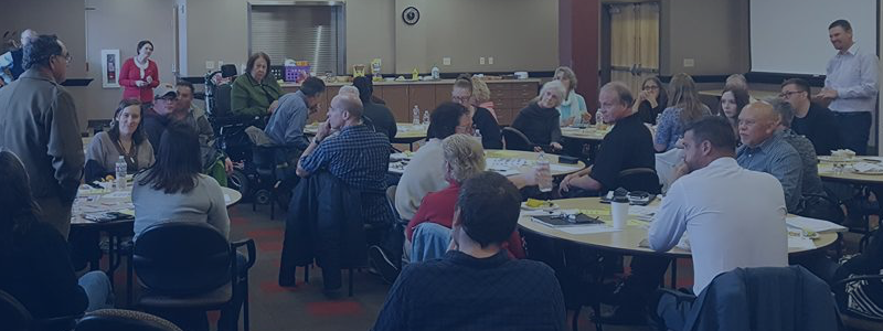 People gathering at a CaN Center meeting