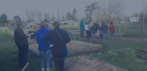 People touring a community garden